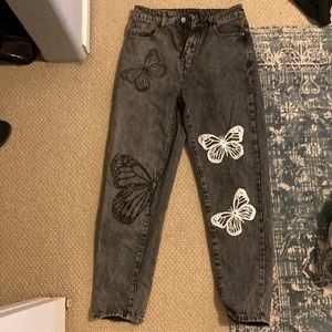 Black jeans with white and black butterfly’s